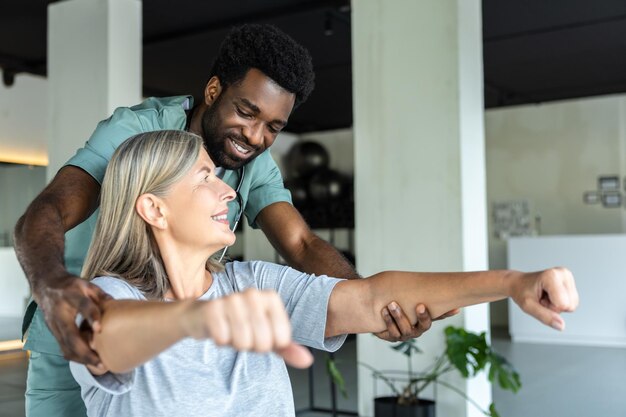 doctor working with adult patient using physiotherapy techniques alleviate pain 259150 83444